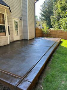 Stained backyard patio by Sam The Concrete Man